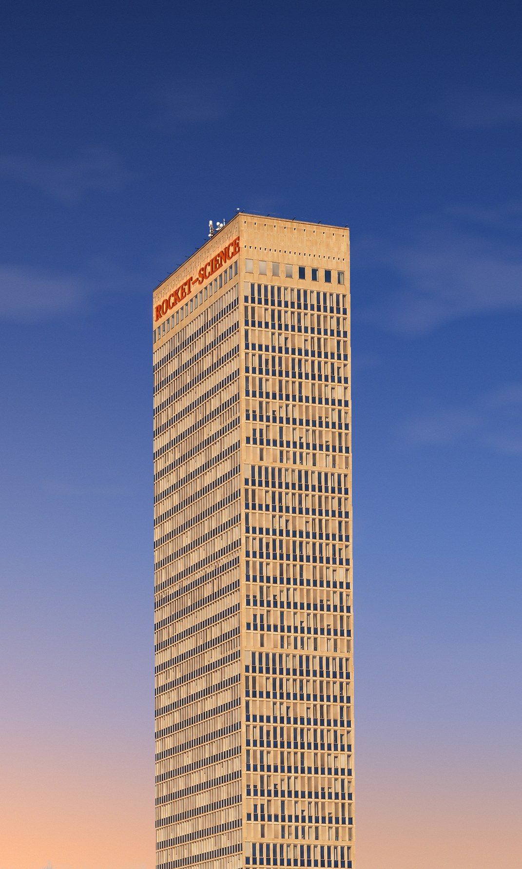 A tall office tower against a sunset sky with the words Rocket—Science on the roof